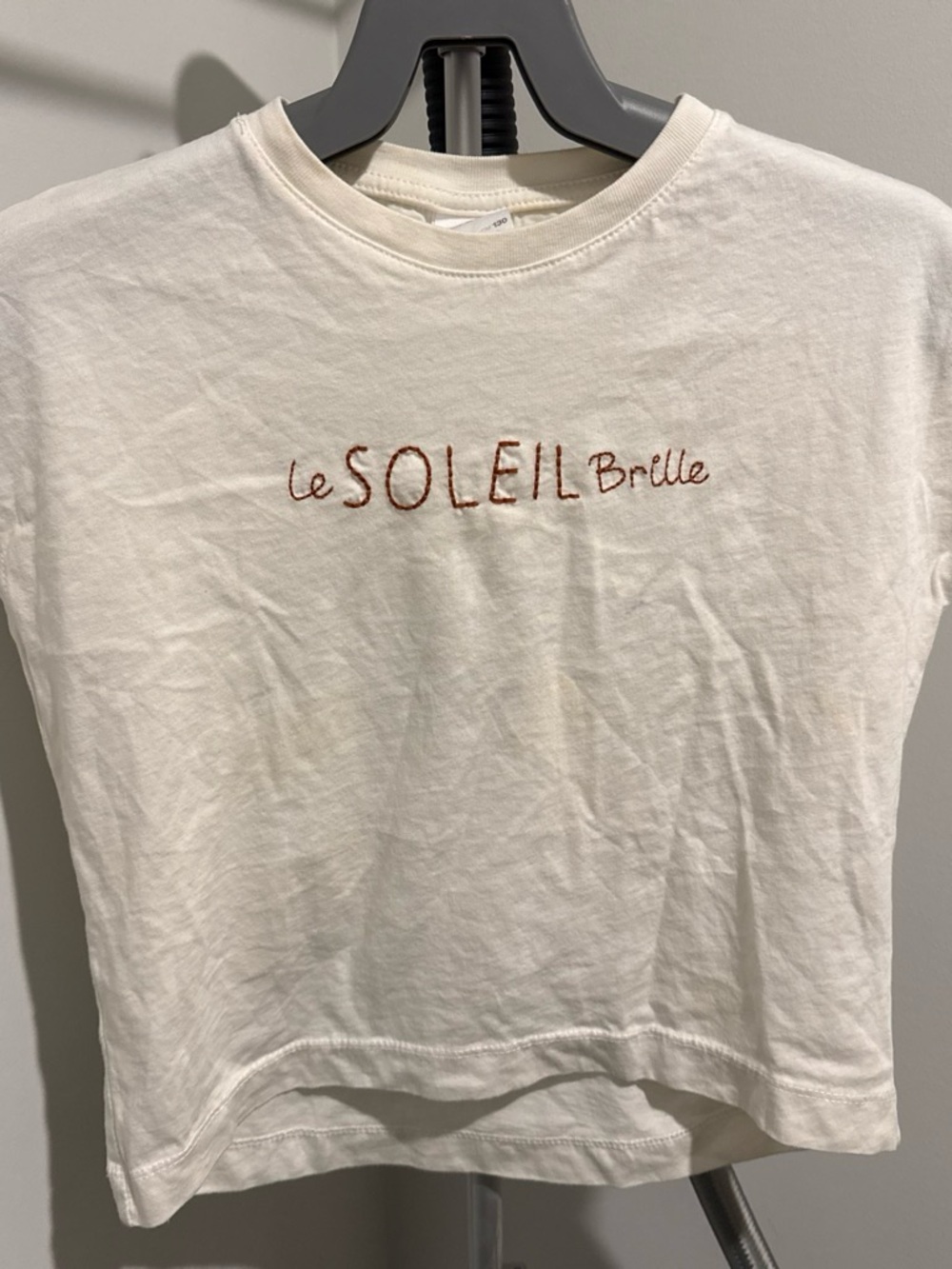 Zara Cream Tee with Rust Script "Le Soleil Brille"